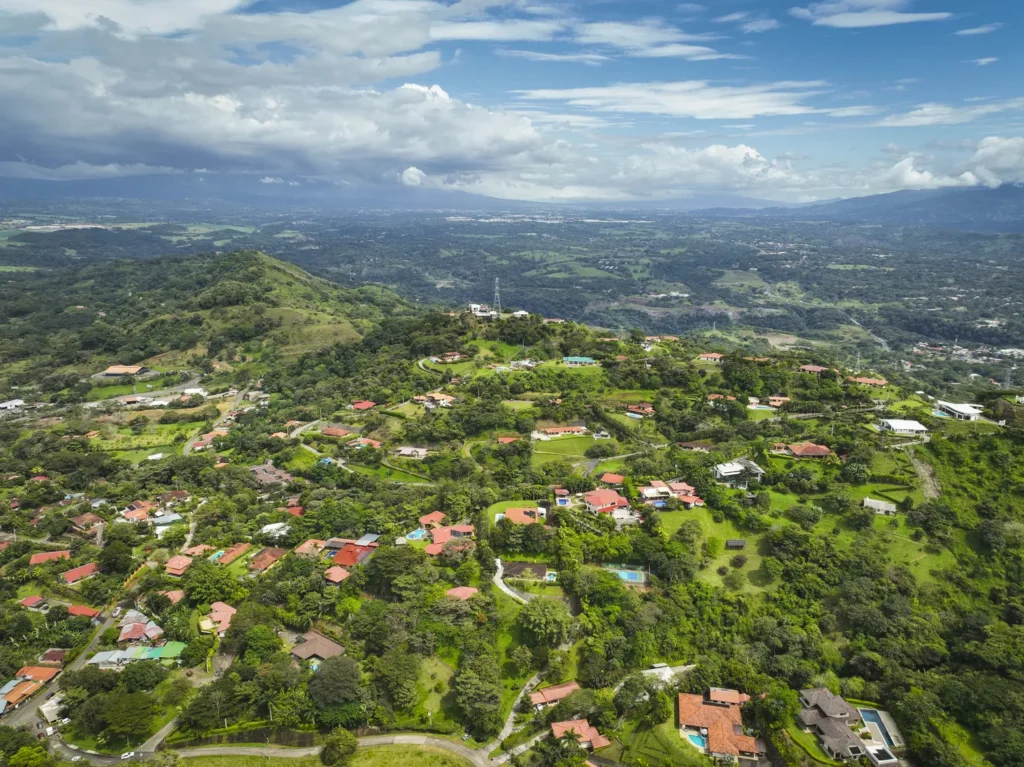 Aerial view of lush green valley and hills.